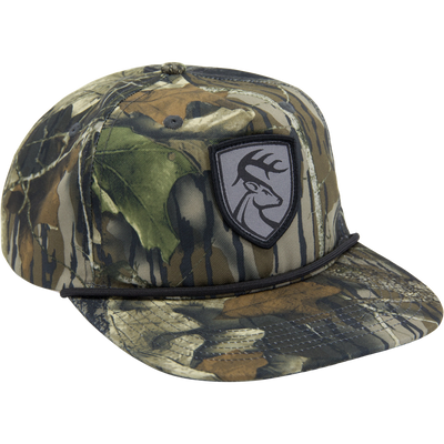 Non-Typical X Lost Hat Goat Rope Hat, a 5-panel camo trucker cap with deer logo patch, adjustable snap back, and rope detail above the brim.
