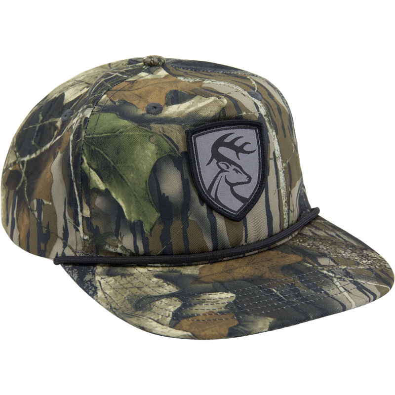 Non-Typical X Lost Hat Goat Rope Hat, a 5-panel camo trucker cap with deer logo patch, adjustable snap back, and rope detail above the brim.