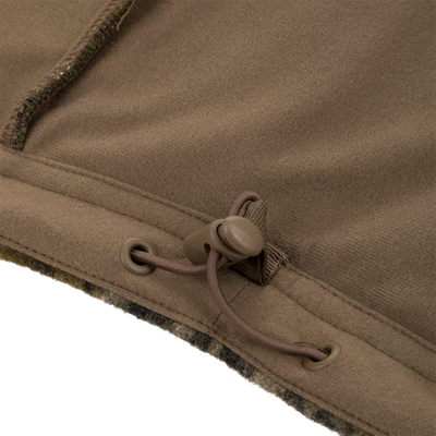 Close-up of Midweight Hydrowool Softshell Jacket hem with drawcord and cord-lock, showcasing windproof, waterproof design for outdoor adventures.