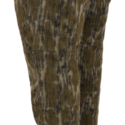 Midweight Hydrowool Softshell Pant with Scent Control featuring olive-green camo-patterned fleece, showcasing durable and waterproof fabric ideal for outdoor and hunting activities.