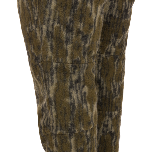 Midweight Hydrowool Softshell Pant with Scent Control featuring olive-green camo-patterned fleece, showcasing durable and waterproof fabric ideal for outdoor and hunting activities.