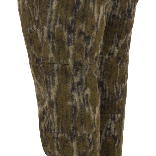 Midweight Hydrowool Softshell Pant with Scent Control featuring olive-green camo-patterned fleece, showcasing durable and waterproof fabric ideal for outdoor and hunting activities.