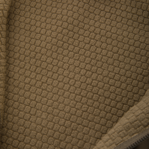 Close-up of tan waffle-textured fleece lining of the Non-Typical SWT Hybrid Half Zip, showcasing breathable fabric and part of a zipper for hunting apparel.
