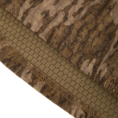 Non-Typical SWT Hybrid Half Zip with Scent Control, featuring camo pattern, overlocked hem, and soft fleece lining, ideal for hunting with moisture-wicking and anti-odor technology.