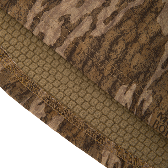 Non-Typical SWT Hybrid Half Zip with Scent Control, featuring camo pattern, overlocked hem, and soft fleece lining, ideal for hunting with moisture-wicking and anti-odor technology.