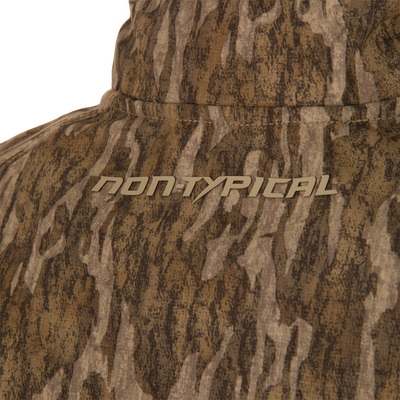 Close-up of the collar area on the Non-Typical SWT Hybrid Half Zip, showcasing its camouflage pattern and NON-TYPICAL text, ideal for hunting apparel.