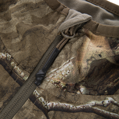 Non-Typical Lightweight SWT Half Zip Pullover with Scent Control, showcasing camo fabric, zippered pocket detail, and paracord pull tab, emphasizing durability and breathability for hunting.