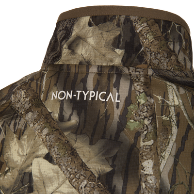 Close-up of the Non-Typical Lightweight SWT Half Zip Pullover, showcasing the camouflage design with NON-TYPICAL text, highlighting its durability and scent control features.
