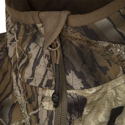 Close-up of Non-Typical Lightweight SWT Half Zip Pullover showcasing camo hood, draw-cord with toggle, and zipper, highlighting breathability and scent control features.