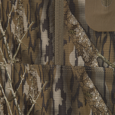 Close-up of the Non-Typical Lightweight SWT Half Zip Pullover, highlighting camo-patterned ripstop fabric with center seam and stitching, showcasing durability and scent control features.