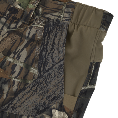 Close-up of Non-Typical SWT Pant with Scent Control, showcasing woodland camouflage print, elastic waistband, top-stitched seams, and cargo pocket, ideal for hunting.