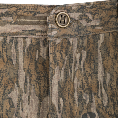 Close-up of the waistband and button closure of Non-Typical Pursuit Softshell Pant with Agion Active X2 camouflage-patterned hunting pants.