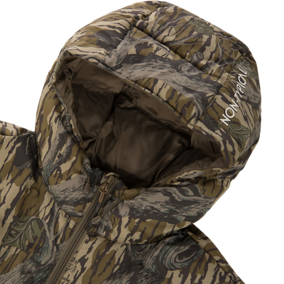 A close-up of the Non-Typical Down Jacket with Agion Active X2 by Nontypical, featuring a green, brown, and gray camo pattern. The hood is up with “NON-TYPICAL” printed in white on the edge.