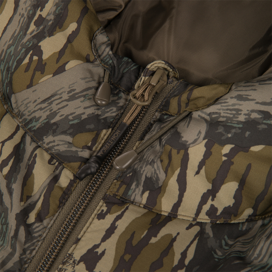 Close-up of the Non-Typical Down Jacket with Agion Active X2 by Nontypical, showing its camouflage pattern, drawstring hood, fabric texture, and partially unzipped front with detailed zipper.