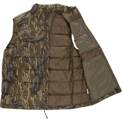 The Non-Typical Down Vest with Agion Active X2 by Nontypical features a camo exterior, solid brown lining, zip front, high collar, and right-side pocket. Open view reveals its insulated design and inner details.