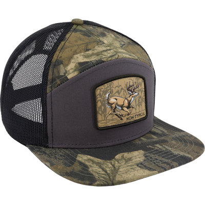 Camo-patterned trucker cap with mesh back, featuring a Non-Typical leaping deer patch, ideal for hunting and outdoor activities.