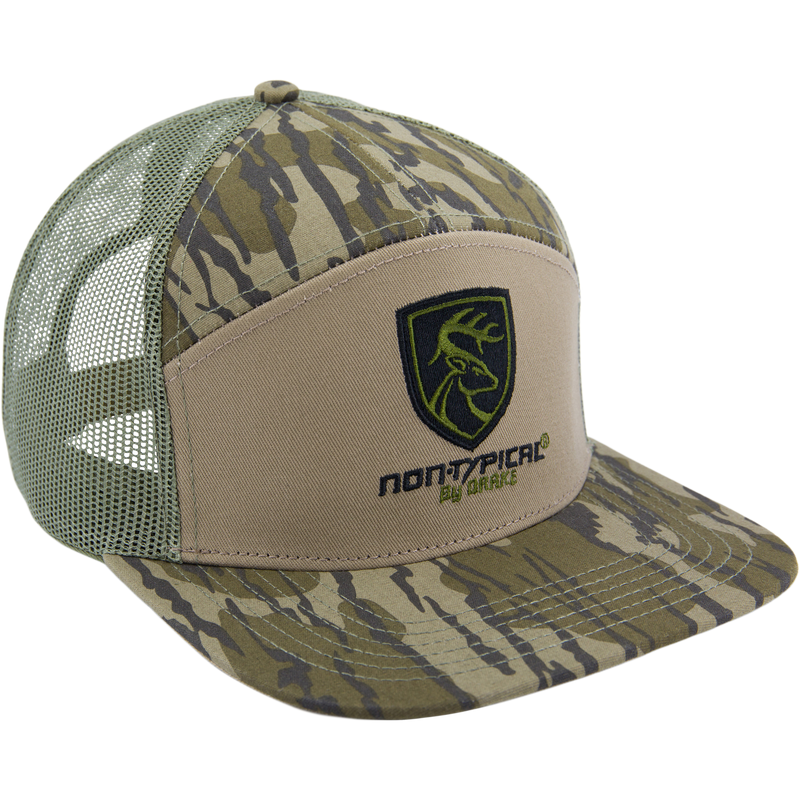 Camouflage-patterned trucker hat with green mesh back, tan front, camo brim, featuring a deer-head shield logo and non-typical® by ORYX, ideal for hunting enthusiasts.