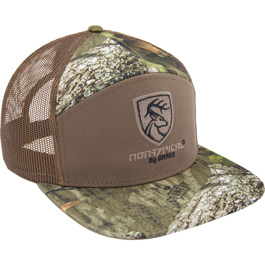 Non-Typical X Lost Sa7age 7 Panel Cap featuring woodland camouflage, embroidered logo, brown mesh back, flat bill, and adjustable snapback.