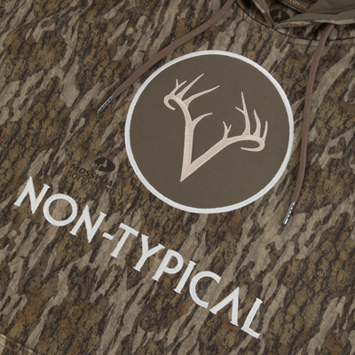 Non-Typical Performance Hoodie with Scent Control, featuring Mossy Oak Bottomland camo, embroidered antler patch, kangaroo pocket, and lined hood, ideal for durable cold-weather hunting.