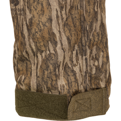 Camouflage Silencer Soft Shell Pant with Agion Active XL scent control, featuring ultra-quiet fabric, adjustable waist, and pockets, designed for mid to late-season hunting.