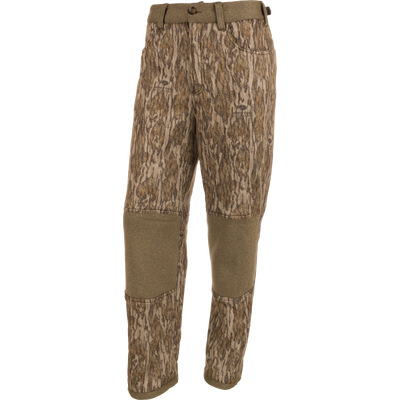 Silencer Soft Shell Pant with Agion Active XL, featuring a camouflage pattern, front and rear pockets, adjustable waist and ankles, and elastic foot stirrups for hunting.