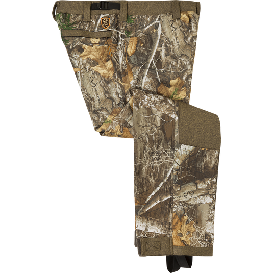 Women's Silencer Pant With Agion Active XL: Camouflage pants with leaves, trees, and text on fabric. Designed for quiet and comfortable deer hunting. Polyester fleece bonded material with scent control technology. Slash pockets, rear pockets, adjustable waist, ankle, and foot stirrups.