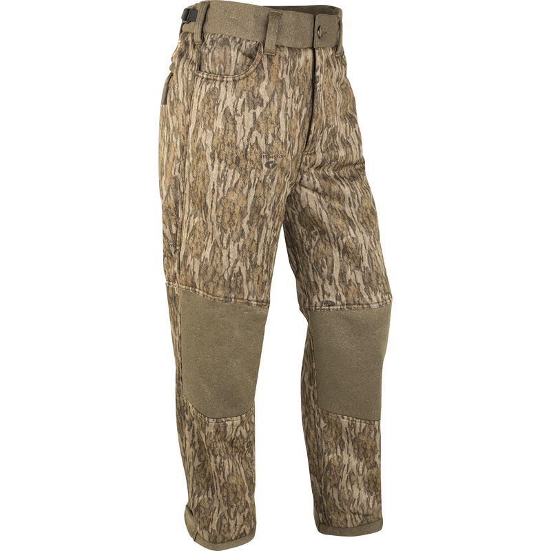 Mossy Oak Bottomland Camo: Silencer Soft Shell Pant with Agion Active XL, a pair of camouflage hunting pants with scent control technology and adjustable features.