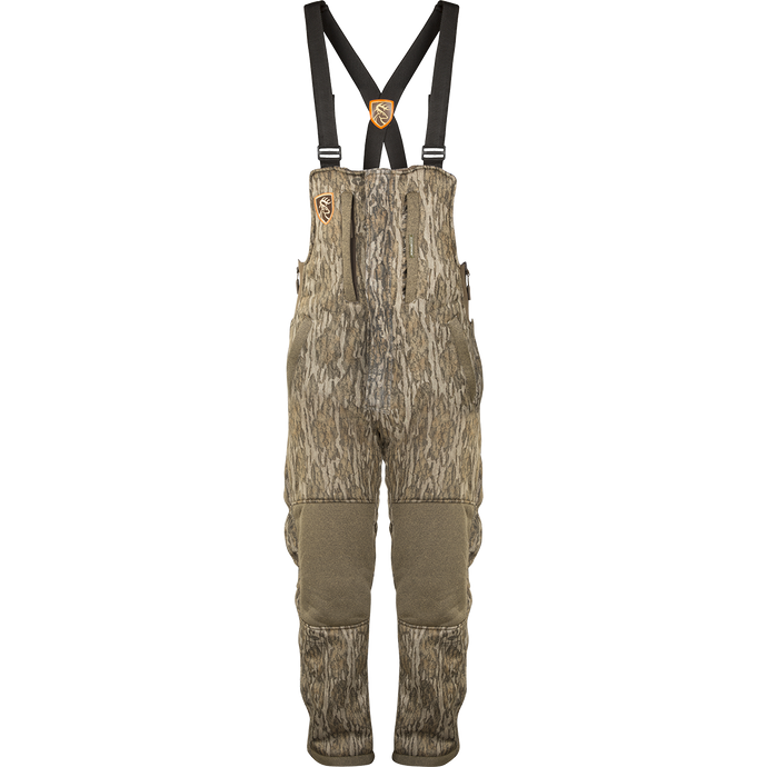 A women's camouflage overalls with suspenders and adjustable waist, perfect for mid-season hunting. Made of high-gauge microfiber interlock stretch fabric with Agion Active XL® scent control technology.