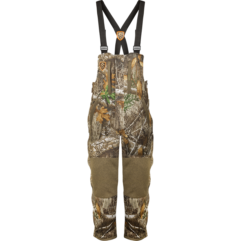 A women's camouflage overalls with straps, fleece-lined, and adjustable waist.