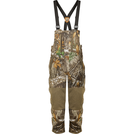 A women's camouflage overalls with straps, fleece-lined, and adjustable waist.