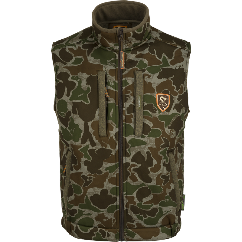A Drake Silencer Vest with Agion Active XL®, featuring camouflage pattern, zippered pockets, and scent control technology.