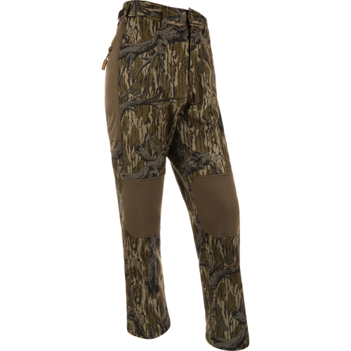 Non-Typical Endurance Pant with Scent Control on mannequin, featuring camouflage pattern, reinforced knees, zip fly, adjustable waist, and multiple pockets, ideal for mid-season hunting.