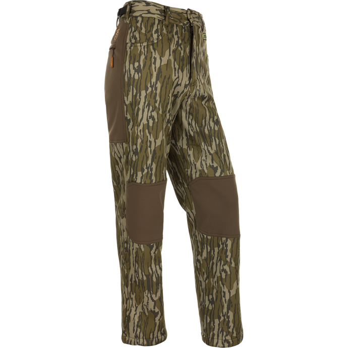 Youth Endurance Pant featuring camouflage design, reinforced knee patches, zippered side pocket, and adjustable waist, ideal for active youth in outdoor activities.