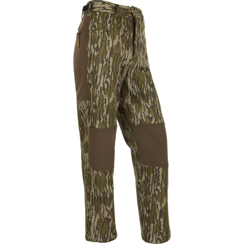 Youth Endurance Pant featuring camouflage design, reinforced knee patches, zippered side pocket, and adjustable waist, ideal for active youth in outdoor activities.