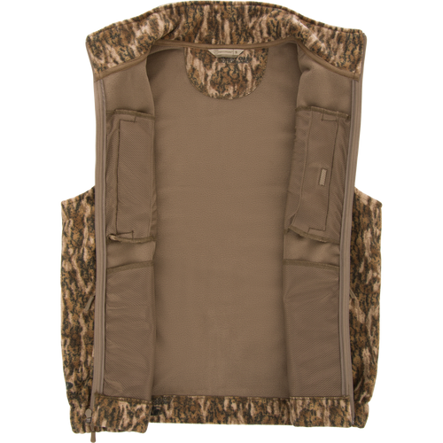 Non-Typical Windproof Layering Vest with a camouflage fleece shell, tan lining, and built-in mesh pockets, ideal for hunting and outdoor activities.