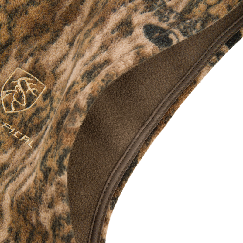 Camo-patterned, fleece-lined bucket hat with embroidered deer-antler logo, designed for outdoor comfort, complements the Non-Typical Windproof Layering Vest by Drake Waterfowl.