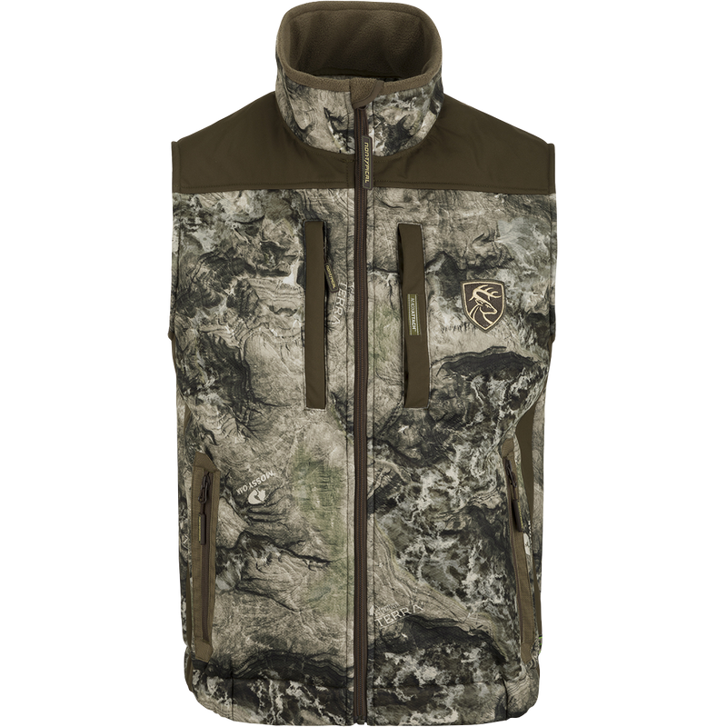 A versatile Standstill Windproof Vest with Agion Active XL® for mid-to-late season hunting. Soft, quiet, and durable fabric perfect for layering or wearing over a mid-layer. Features zippered pockets and safety harness pass-through opening.