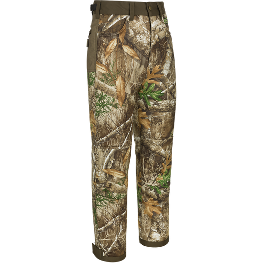 A pair of Standstill Windproof Pants with Agion Active XL®, perfect for late-season hunts. Soft, quiet, and durable, these pants are your weapon against the cold and winds. Features adjustable waist and cuffs, front slash pockets, cargo pockets, and rear pockets. Made with 100% Polyester Microfiber Interlock Standstill Fabric and 400-gram Polyester Fleece Backing. Final Sale. From Drake Waterfowl.