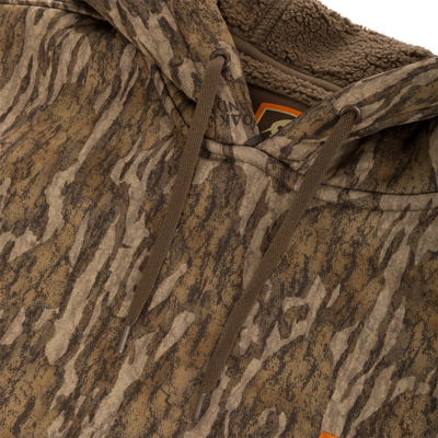 Non-Typical Silencer Hoodie with Agion Active X2 features a brown-and-tan camo print, draw-cords through metal grommets, and a sherpa-lined hood for warmth.