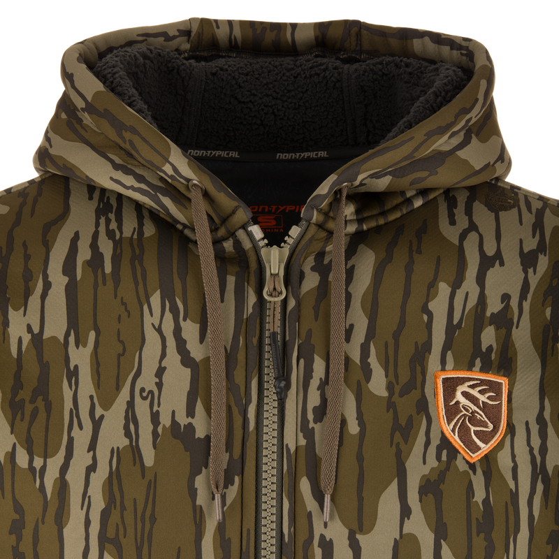 Non-Typical Silencer Full Zip Hoodie, camouflage with drawstring hood, fleece-lined, embroidered deer patch, metal zipper, ideal for hunting with warmth and quietness.