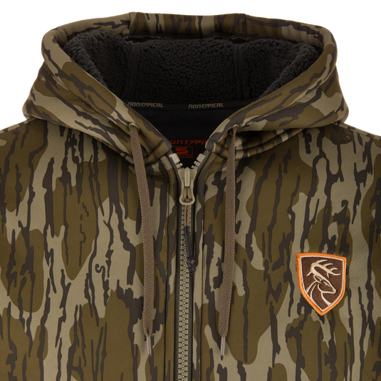 Non-Typical Silencer Full Zip Hoodie, camouflage with drawstring hood, fleece-lined, embroidered deer patch, metal zipper, ideal for hunting with warmth and quietness.