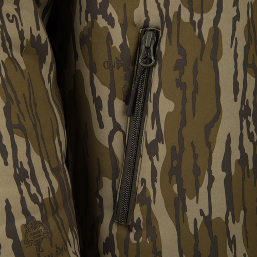 Non-Typical Silencer Full Zip Hoodie featuring a camo print with Midland logo and Mossy Oak emblem, showcasing a vertical zip pocket for hunting.