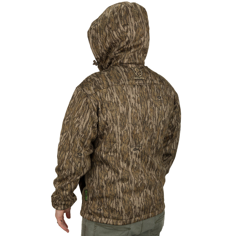 A person wearing the Endurance 1/4 Zip Jacket, a lightweight camouflage jacket ideal for cool fall days. Features a quarter-zip neck and a vertical magnetic chest pocket. Made of polyester microfiber interlock fabric.