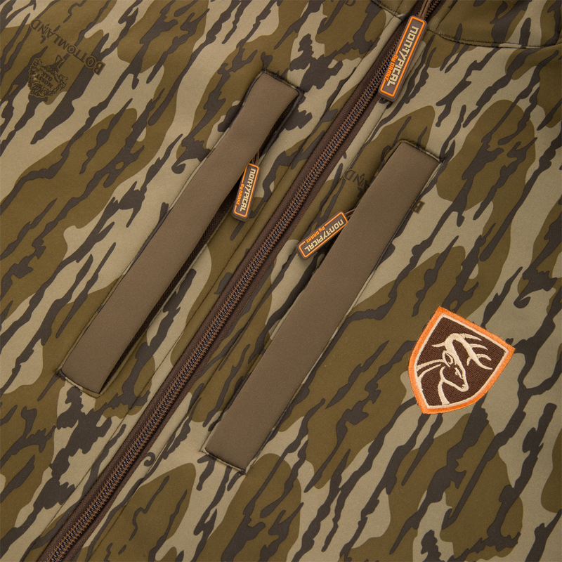 Non-Typical Endurance Hooded Full Zip Jacket with Scent Control featuring camo pattern, zippered chest pockets, central zipper, and deer head patch, ideal for mid-season hunting.