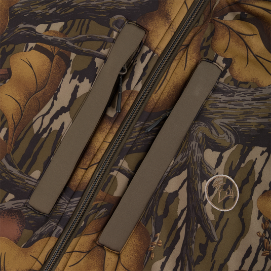 Close-up of a Non-Typical Endurance Hooded Full Zip Jacket with Scent Control, featuring a camouflage pattern, vertical zippered pockets, an adjustable hood, and a circular logo patch.