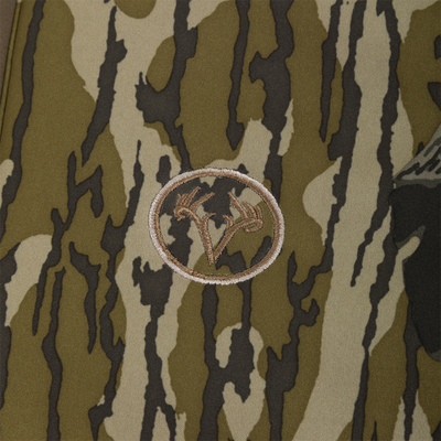 Embroidered circular logo featuring a deer antler design on a camouflage Nontypical Youth Endurance Full Zip Jacket with Hood.