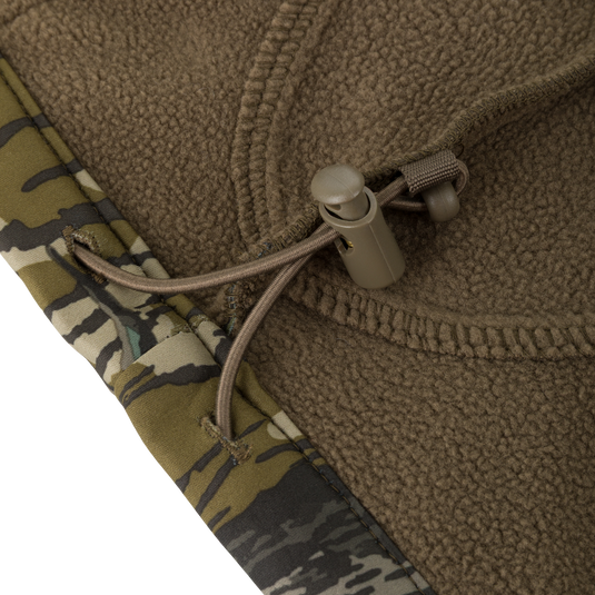 Close-up of a brown microfiber stretch hood with a drawstring toggle on a Youth Endurance Full Zip Jacket with Hood.
