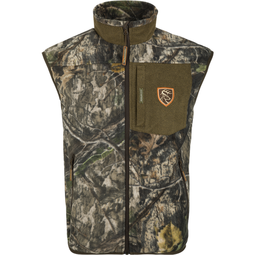 A windproof layering vest with a patch and logo, perfect for keeping your core warm and arms free. Features Agion Active XL® scent control technology and multiple pockets.