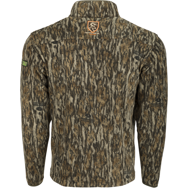 A jacket with a camouflage pattern, featuring a logo of a deer and a close-up of a camouflage pattern. This Storm Front Fleece Midweight 4-Way Stretch 1/4 Zip Pullover - Realtree is made of 100% Polyester 200 gram 4-Way Stretch Fleece. Perfect for big game hunters, it provides quiet, warm, moisture-wicking insulation.