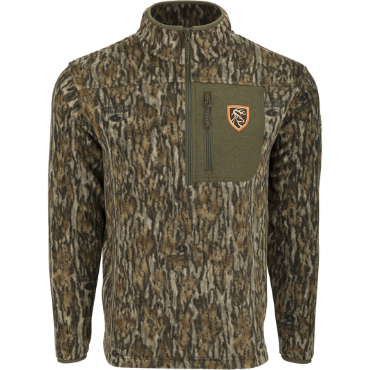 A close-up of a camouflage jacket with logo and deer emblem, featuring a zipper detail. Ideal for big game hunters.